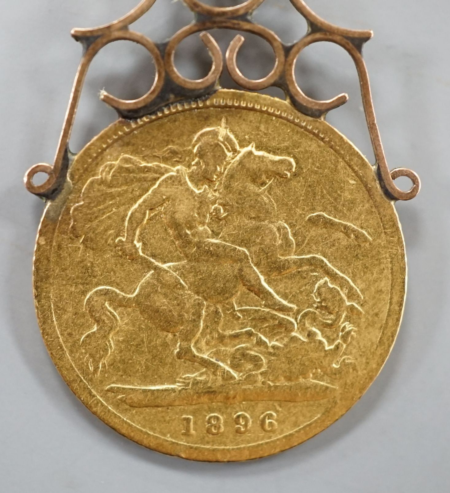 A Victorian gold 1896 half sovereign, now with yellow metal pendant mount
